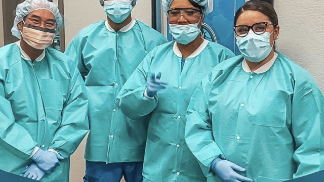 Jefferson Dental team dressed in PPE, to promote infection control